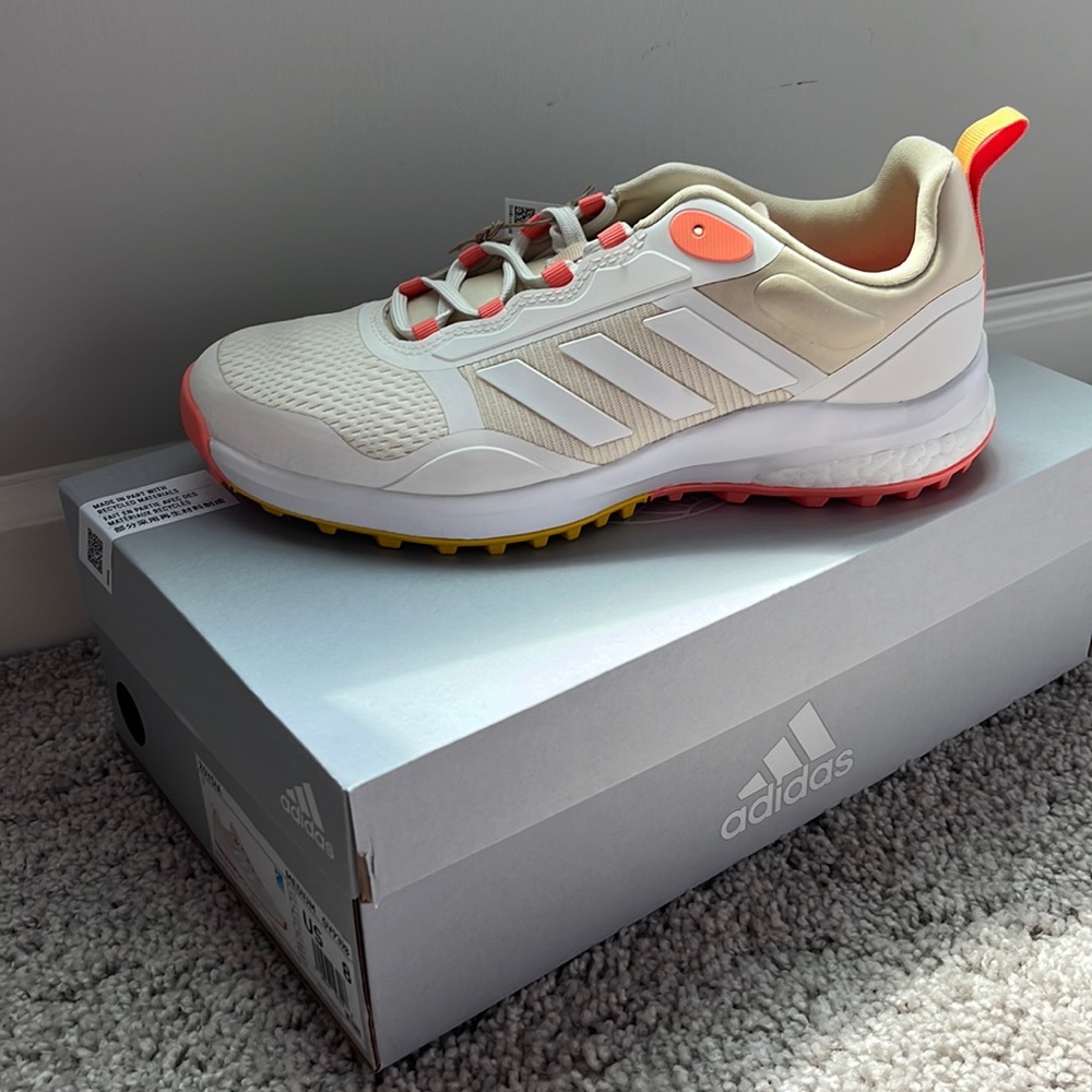 ZOYSIA Spikeless gold shoe by Adidas